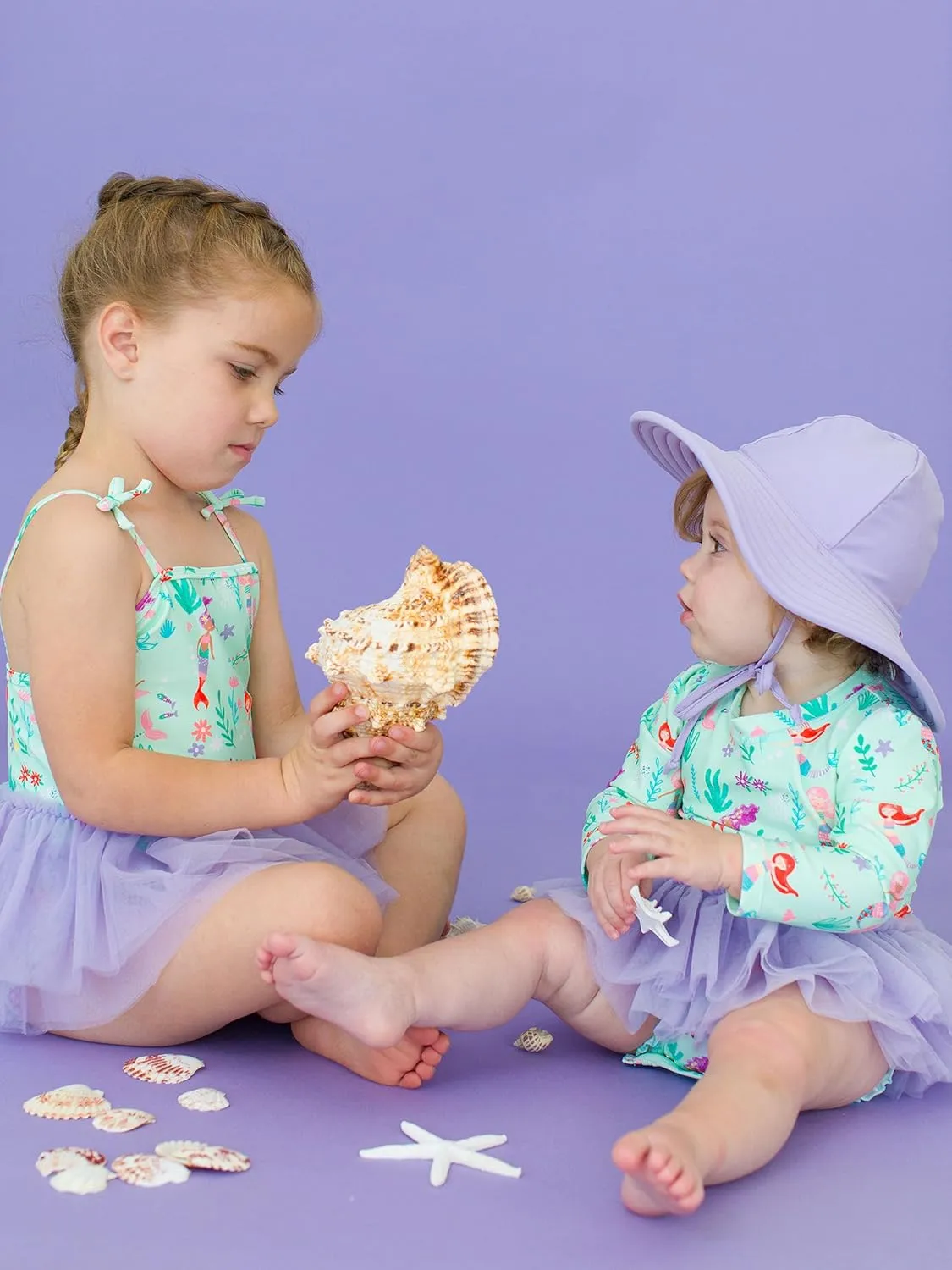 RuffleButts Baby Girls UPF 50  Sun Protection Tulle Skirted Long Sleeve One Piece Rash Guard Swimsuit