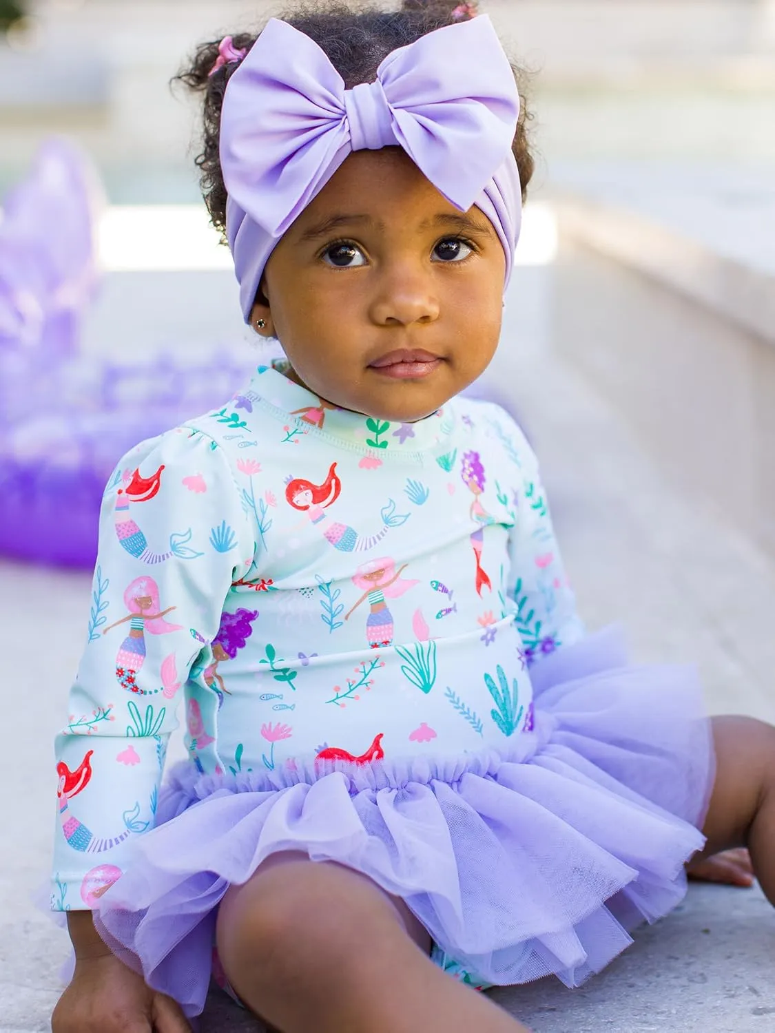 RuffleButts Baby Girls UPF 50  Sun Protection Tulle Skirted Long Sleeve One Piece Rash Guard Swimsuit
